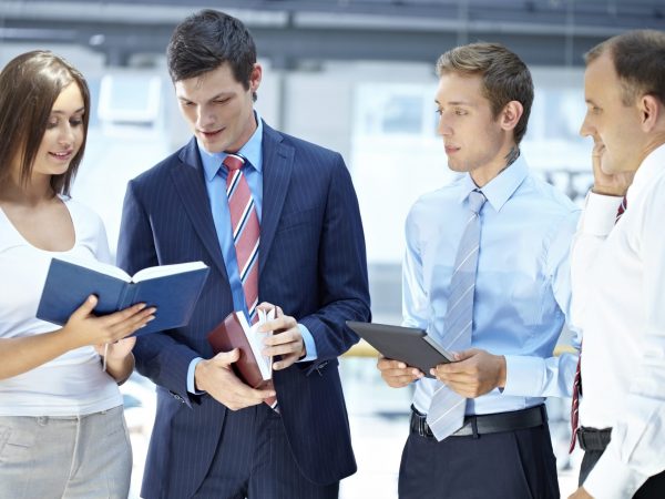 Young people standing together and discussing something